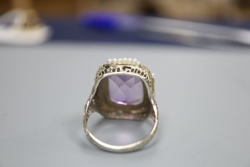 A seed pearl and amethyst dress ring, the shank stamped 14k, size L/M